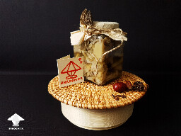 Crafted decorated jar with homemade fermented mushrooms 