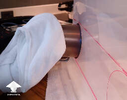 Press and twist hot metal can or mug to melt the plastic